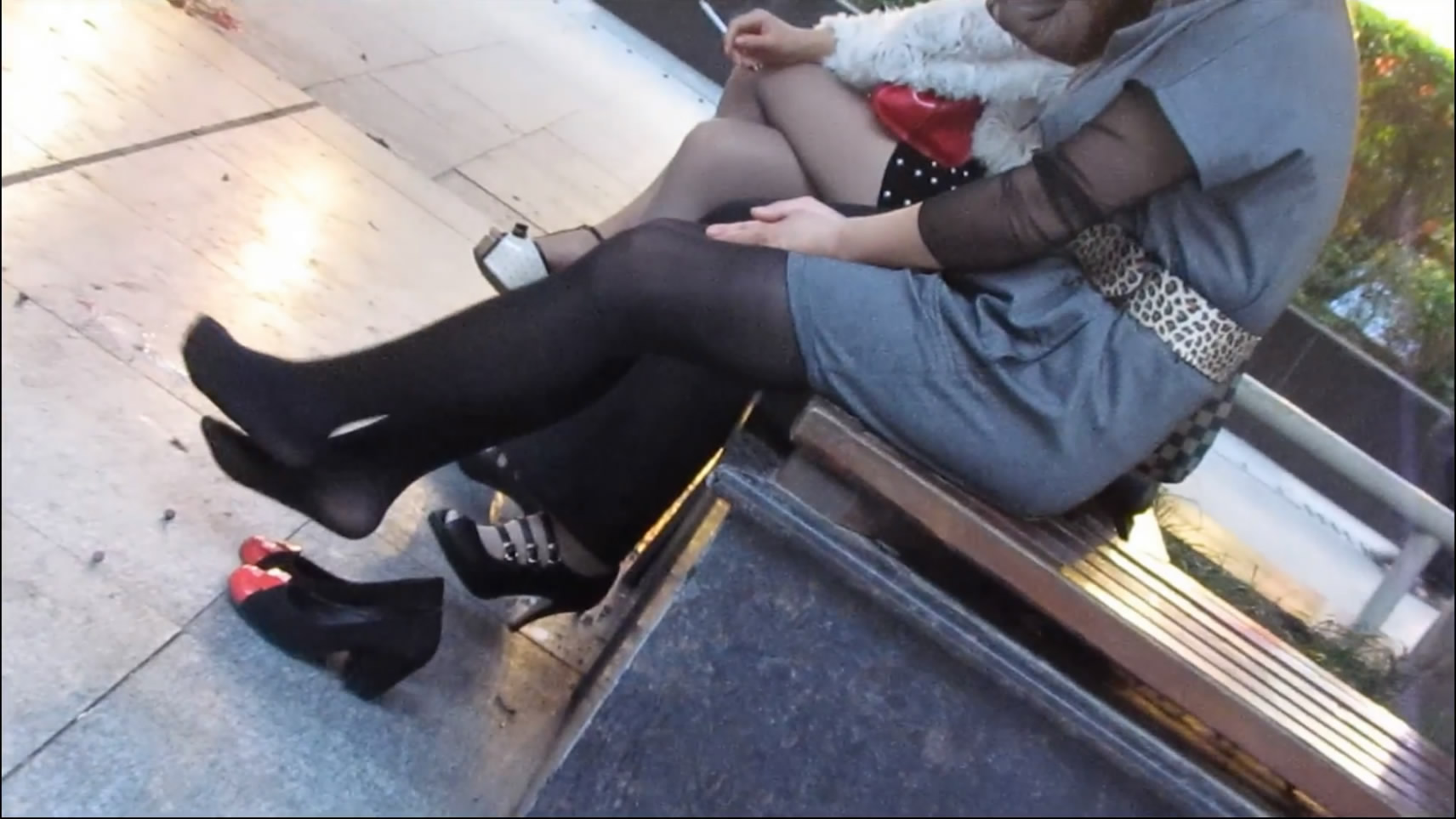 Women with Cigarettes and Playing Her Shoe